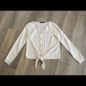 Blouse with gold buttons
